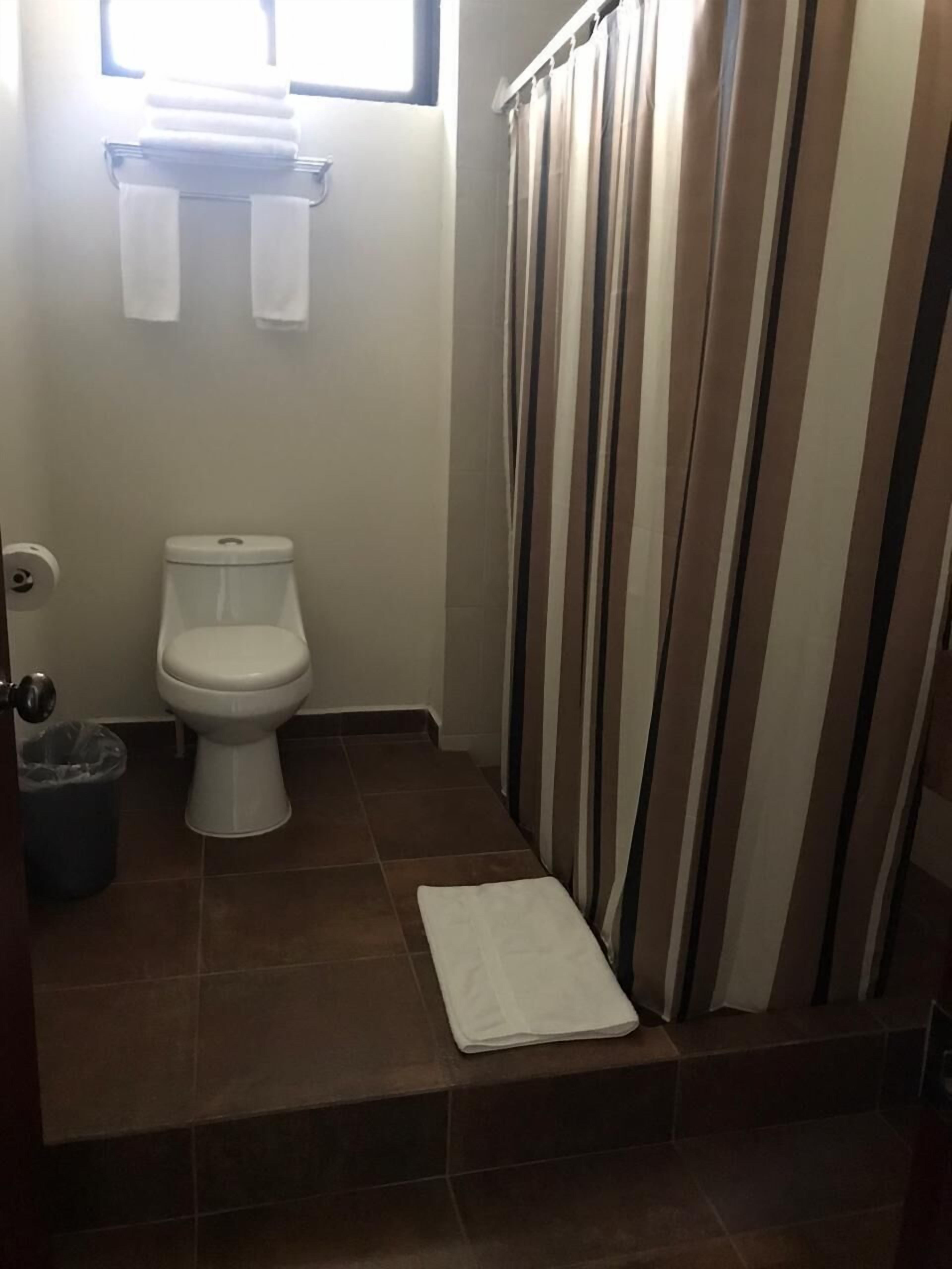comfort room | bathroom | hair dryer, towels, soap, shampoo