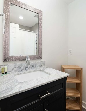 Shower, hair dryer, towels, shampoo