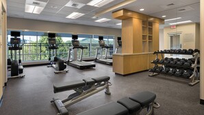 A gym with treadmills, weight machines, and dumbbells. - TownePlace Suites by Marriott Boone (Boone)