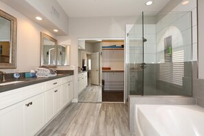 Combined shower/bathtub, hair dryer, towels, soap