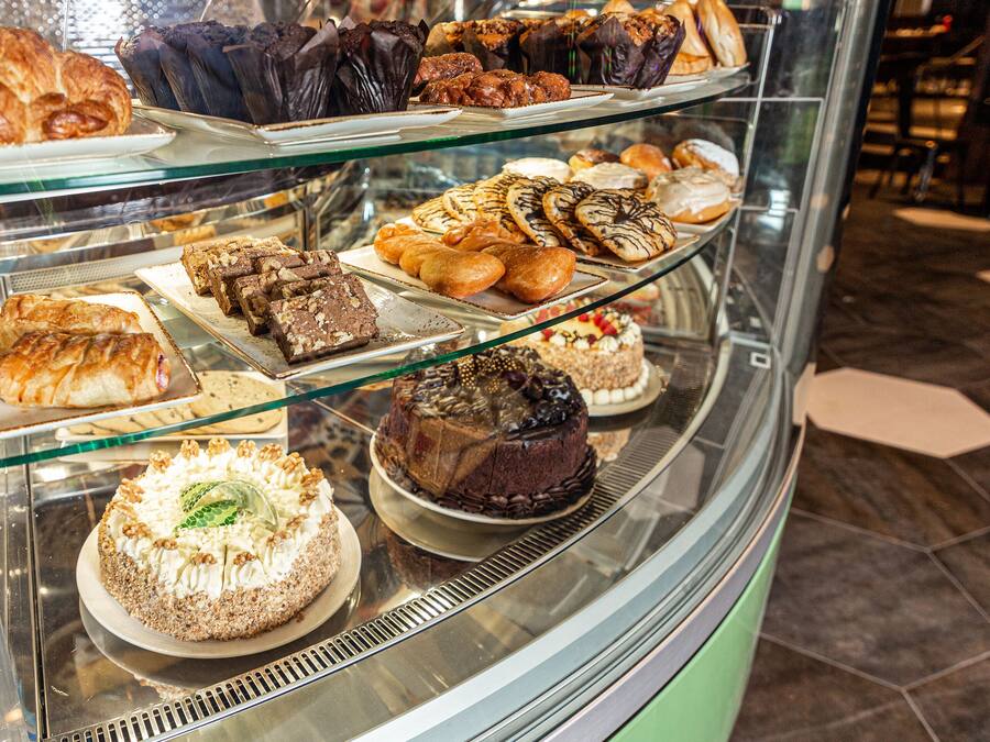 A bakery display case with various baked goods.