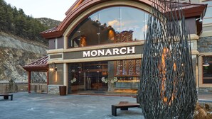 A building with a large arched entrance and the name "MONARCH" displayed prominently. - Monarch Casino Resort Spa Black Hawk (Black Hawk)