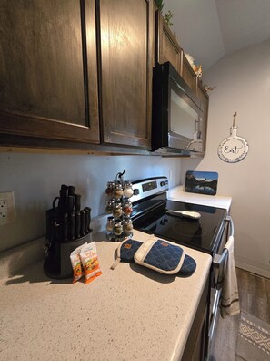 Fridge, microwave, oven, stovetop - Eagle's Nest: a cozy cabin beneath the pines at Glacier Lodge Cabins (Coram)