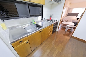 Apartment, 1 Bedroom | Private kitchen | Fridge, microwave, stovetop, electric kettle