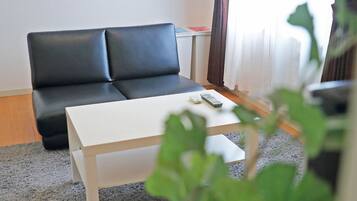 Apartment, 1 Bedroom (Large) | Living room | 43-inch flat-screen TV with digital channels, TV