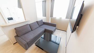 Apartment, 1 Bedroom | Living area | 43-inch flat-screen TV with digital channels, TV