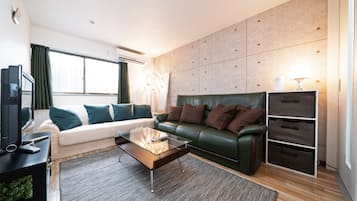 Apartment, 1 Bedroom | Living room | 43-inch flat-screen TV with digital channels, TV