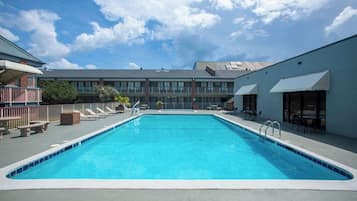 Seasonal outdoor pool, open 9:00 AM to 9:00 PM, pool loungers