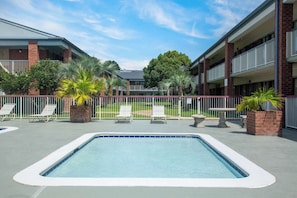 Seasonal outdoor pool, open 9:00 AM to 9:00 PM, sun loungers - Days Inn by Wyndham Mobile I-65 (Mobile)
