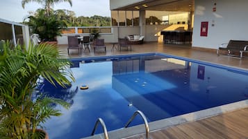 Outdoor pool, open 7:00 AM to 10:00 PM, pool loungers