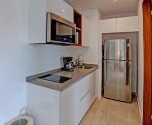 Deluxe Apartment, 1 King Bed | Private kitchen | Full-size fridge, microwave, cookware/dishes/utensils - Unwind In An Exquisitely Furnished Studio , PANORAMIC C 202- By Salt - Kisses (Tulum)