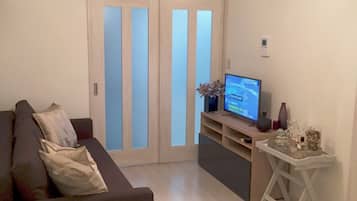 Three-Bed Room (Double Size Bed) | Living room | Flat-screen TV