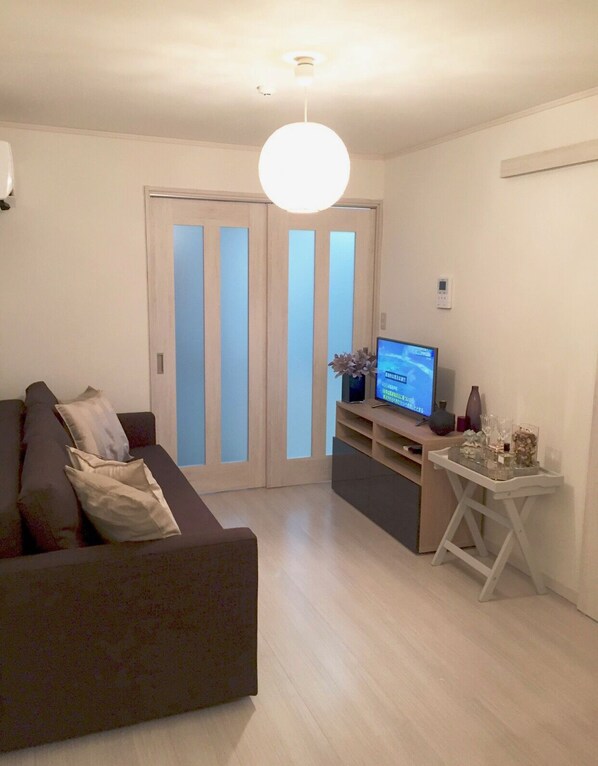 Three-Bed Room (Double Size Bed) | Living room | Flat-screen TV