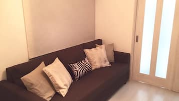 Three-Bed Room (Double Size Bed) | Living room | Flat-screen TV