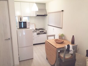 Three-Bed Room (Double Size Bed) | Private kitchenette | Fridge, microwave, stovetop, coffee/tea maker - Private Vacation Home near Tamachi Station (Tokyo)