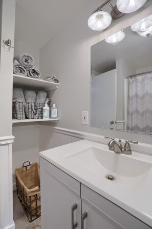 Bathtub, hair dryer, towels