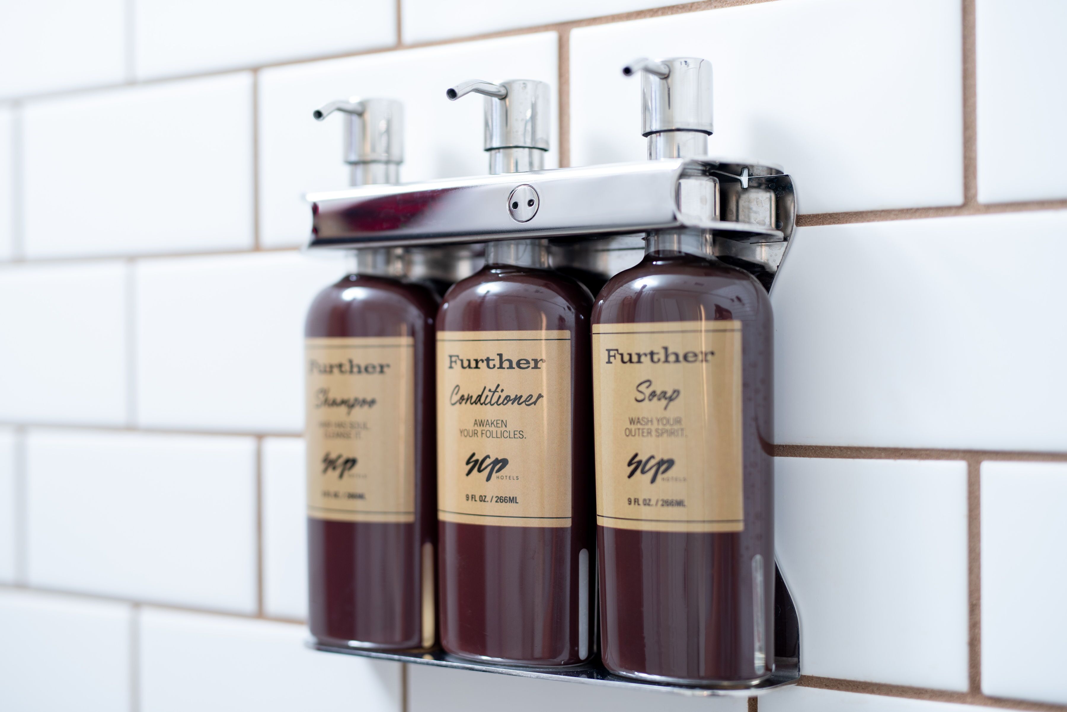 shower, designer toiletries, hair dryer, towels