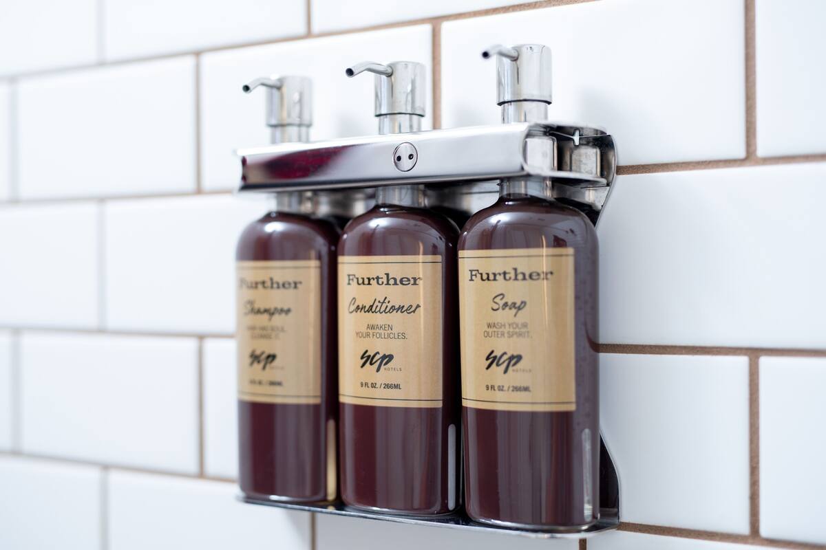 shower, designer toiletries, hair dryer, towels