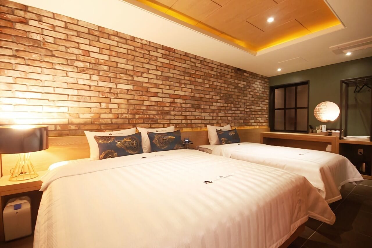 vip twin bedroom | desk, laptop workspace, blackout curtains, soundproofing