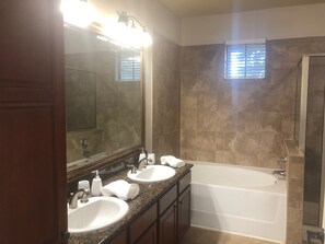 Combined shower/tub, hair dryer, towels, soap