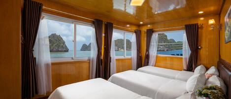 Deluxe Triple Room | 1 bedroom, minibar, in-room safe, individually decorated