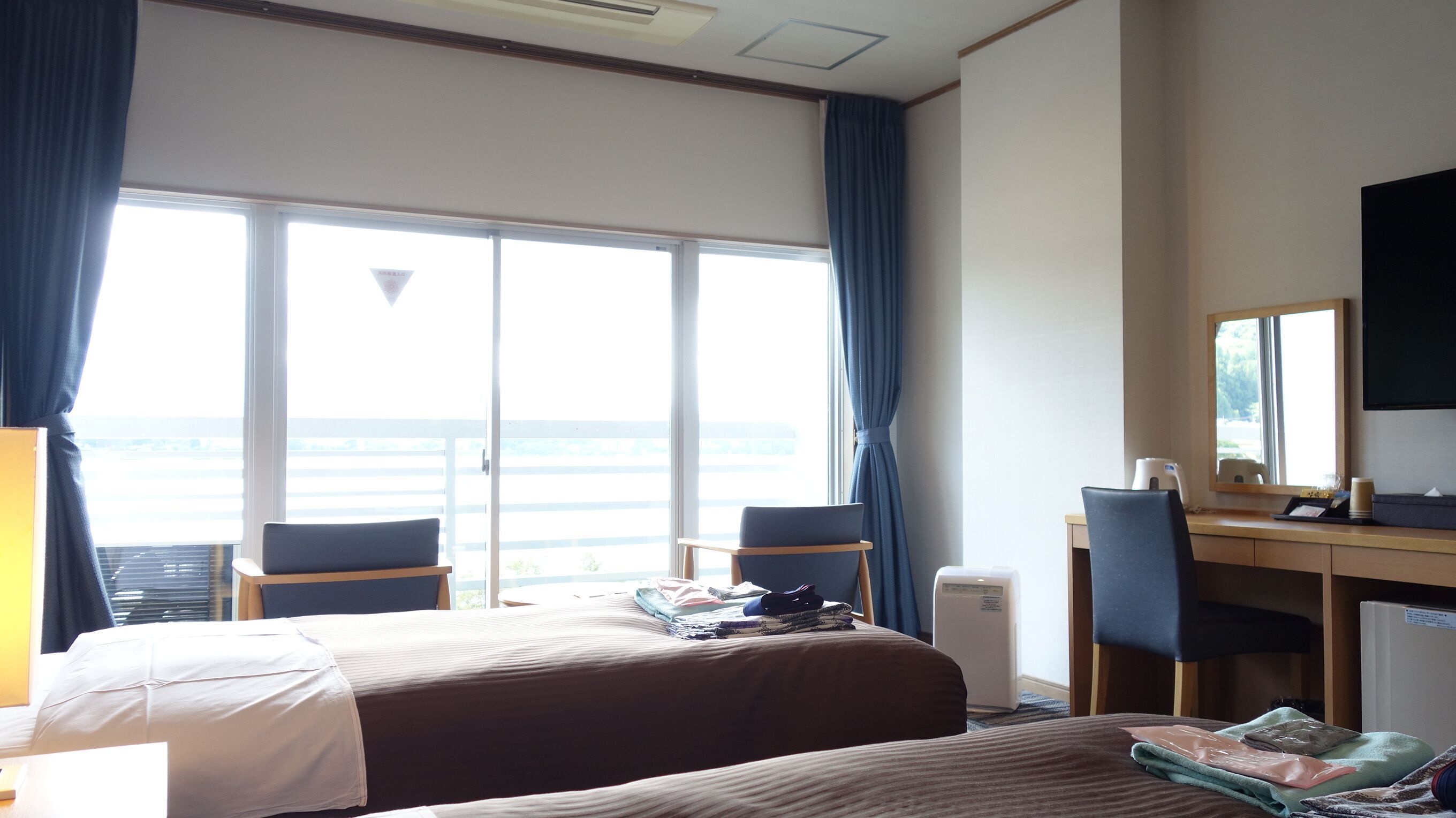 mountain view and lake view western twin room | in-room safe, free wifi