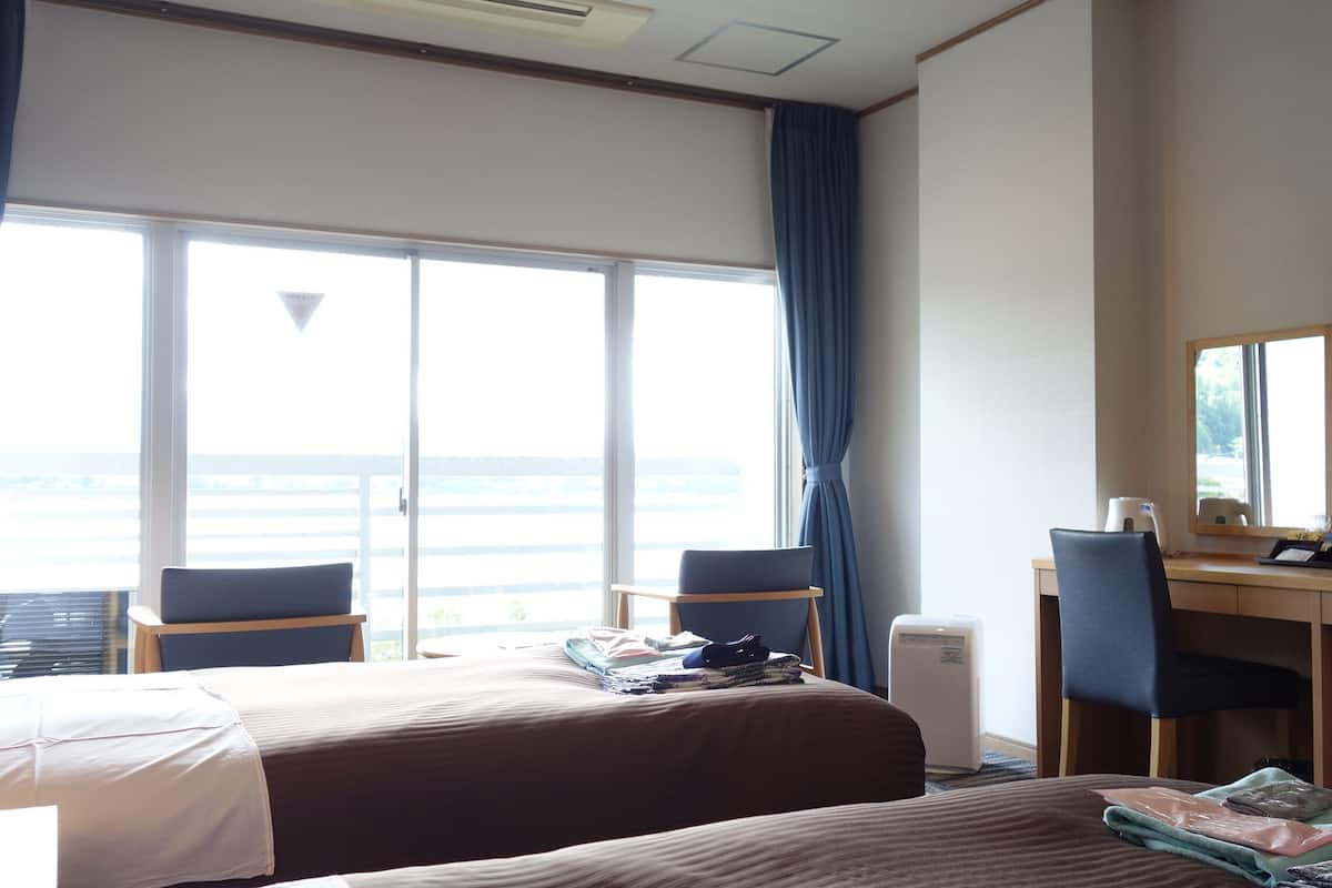 mountain view and lake view western twin room | in-room safe, free wifi