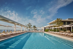 Seasonal outdoor pool, pool umbrellas, pool loungers