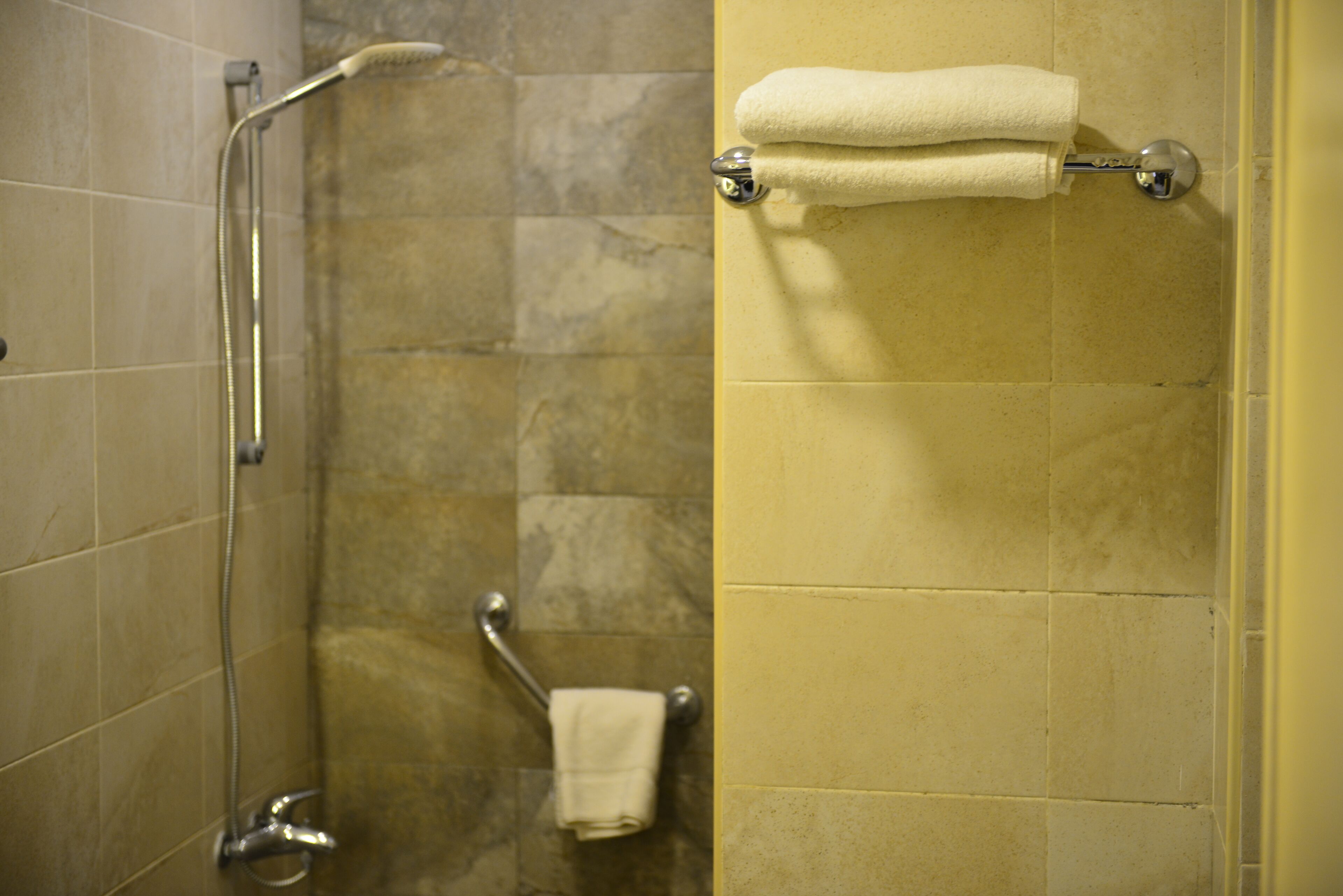 rainfall showerhead, hair dryer, bathrobes, slippers