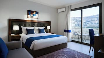 Hypo-allergenic bedding, free minibar, in-room safe