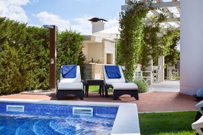 Seasonal outdoor pool, pool umbrellas, pool loungers