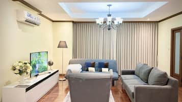 3 Bedrooms Apartment | Living room | 55-inch LCD TV with cable channels, TV