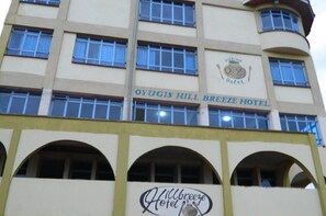 The exterior of the Oyugis Hill Breeze Hotel with a sign indicating its name. - Oyugis Hill Breeze Hotel (Oyugis)