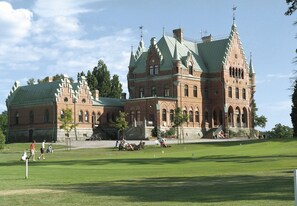 A large, historic building with a green roof and multiple towers. - Torreby Slott Hotel & Golf (Munkedal)