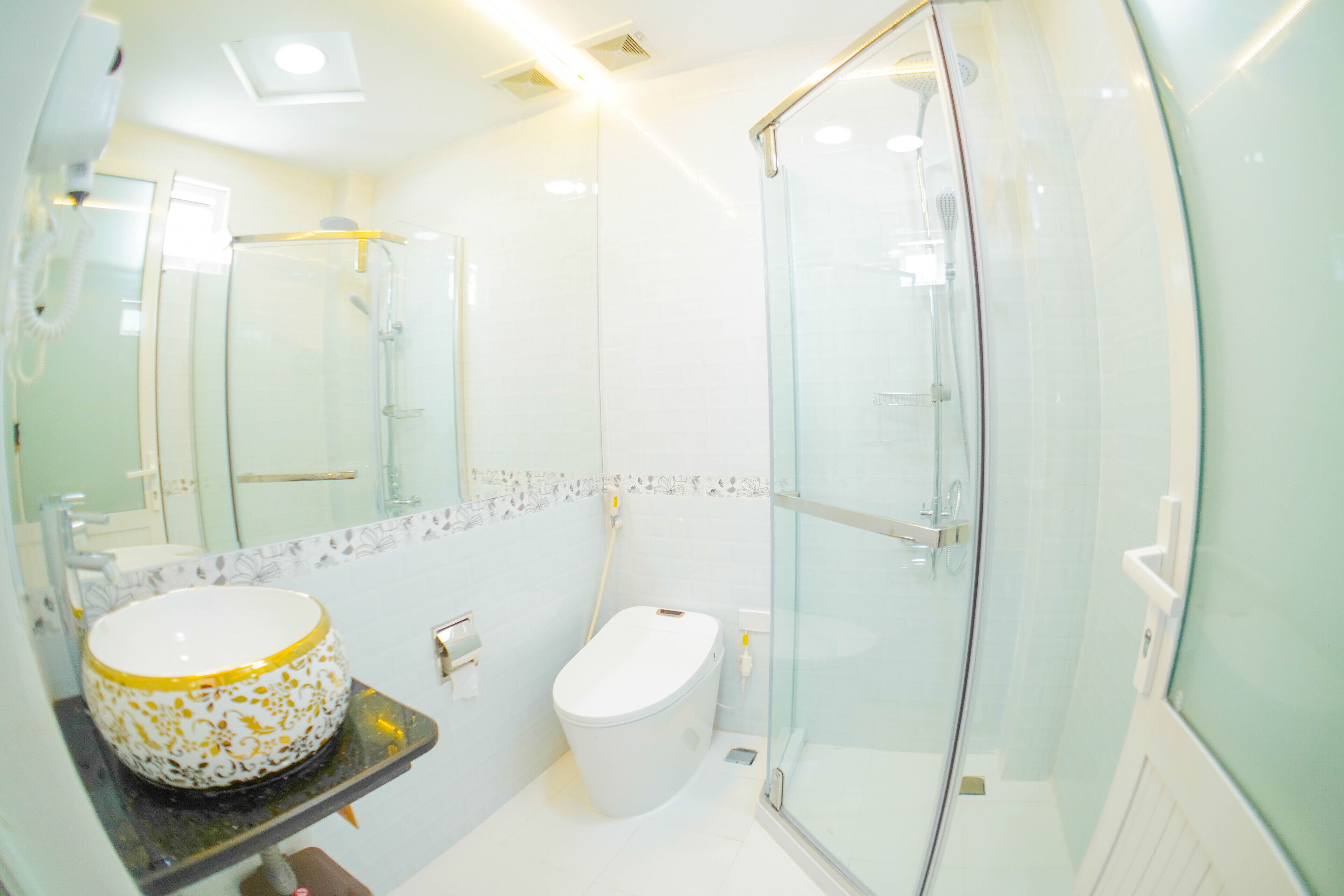 Designer toiletries, hair dryer, slippers, towels