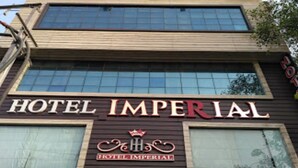A building with a sign that reads "HOTEL IMPERIAL" and a logo with a crown. - Hotel Imperial (Ajmer)