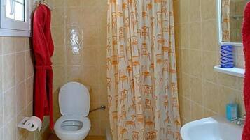 Shower, hair dryer, towels, toilet paper