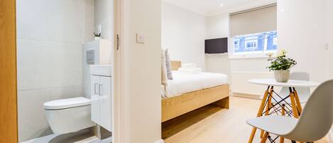 Top Floor Small Studio | Living area | 37-inch Smart TV with cable channels, TV, heated floors