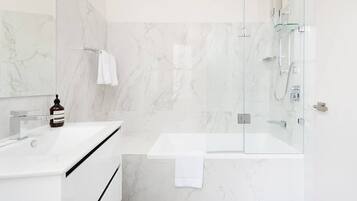 Bathtub, hair dryer, towels