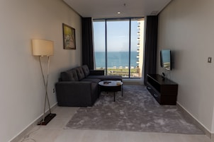 Double or Twin Room, 1 Large Twin Bed, Sea View | Living area | 40-inch Smart TV with cable channels, TV, heated floors