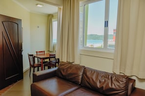 Superior Penthouse | Living area | 32-inch flat-screen TV with cable channels, TV