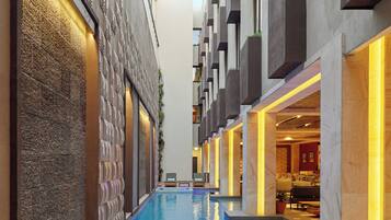 Indoor pool, open 7:00 AM to 8:00 PM, pool loungers