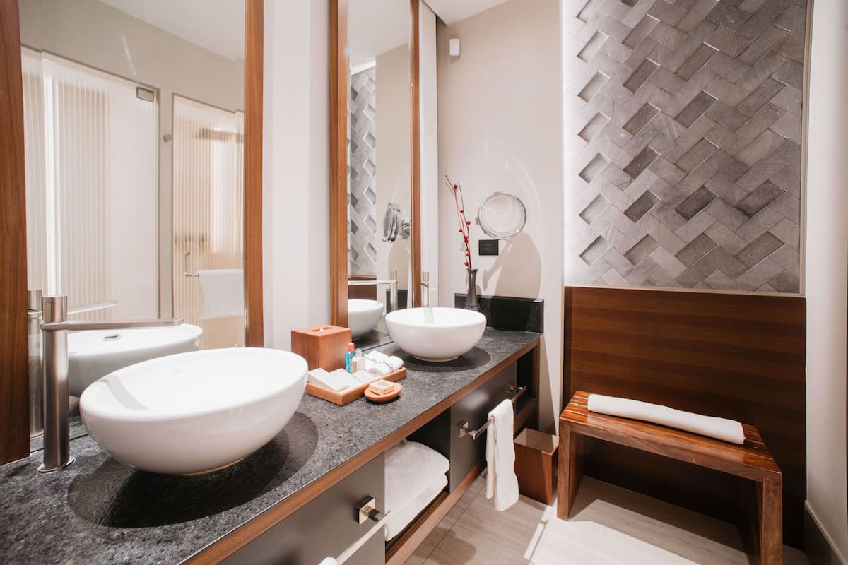 designer toiletries, hair dryer, bathrobes, slippers