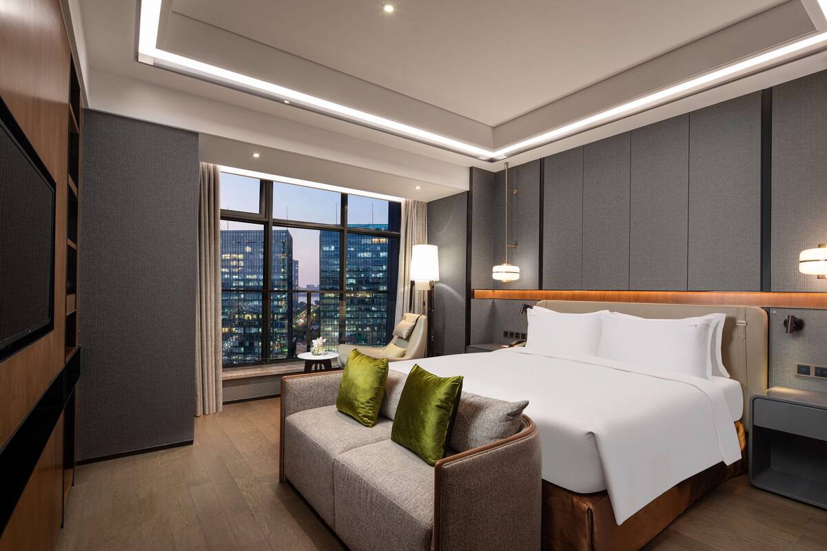 Suite, 1 Bedroom (Living Dining Areas) | Minibar, desk, iron/ironing board, WiFi (free)