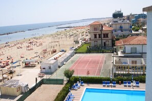Seasonal outdoor pool, open 9:30 AM to 6:30 PM, pool umbrellas