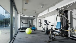 A modern gym with exercise equipment, a treadmill, and exercise balls. - Central Islington (Townsville)