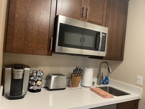 Fridge, microwave, coffee/tea maker, toaster