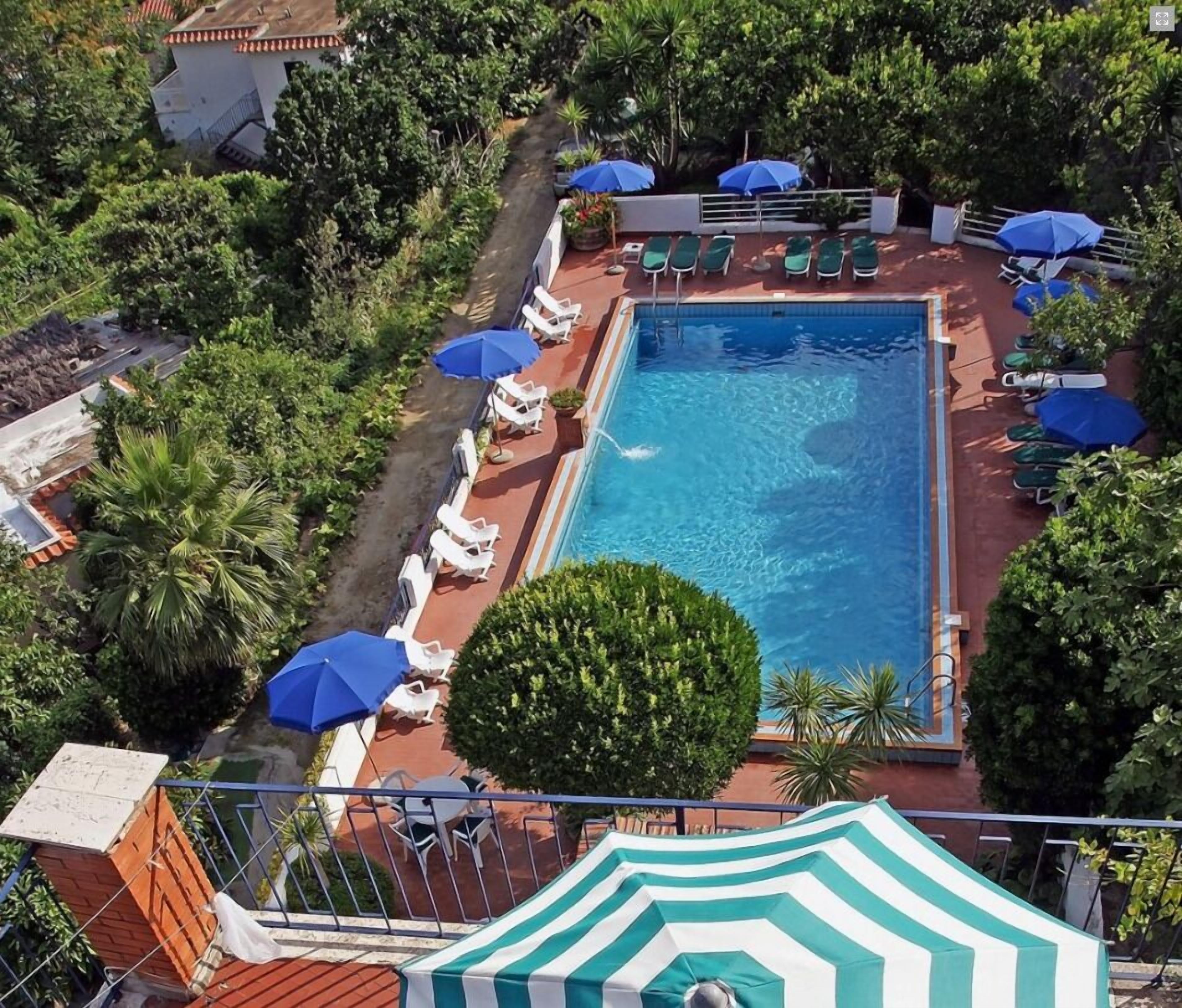 Indoor pool, seasonal outdoor pool, pool umbrellas, pool loungers