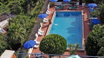 Indoor pool, seasonal outdoor pool, pool umbrellas, pool loungers