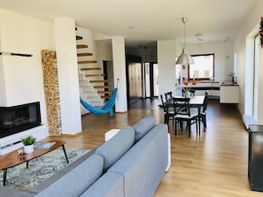 Family Apartment, 3 Bedrooms | Living area | 105-cm flat-screen TV with digital channels, TV, fireplace